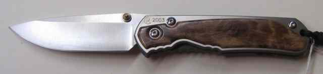 Appraisal: CHRIS REEVE MODEL FOLDING KNIFE '' hollow ground locking blade