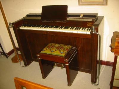 Appraisal: AN EAVESTAFF MINI PIANO in Art Deco mahogany case with