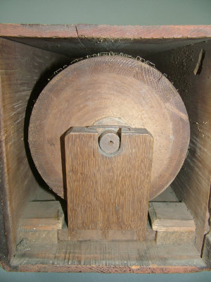 Appraisal: A wooden stitching roller in it's wooden box overall length