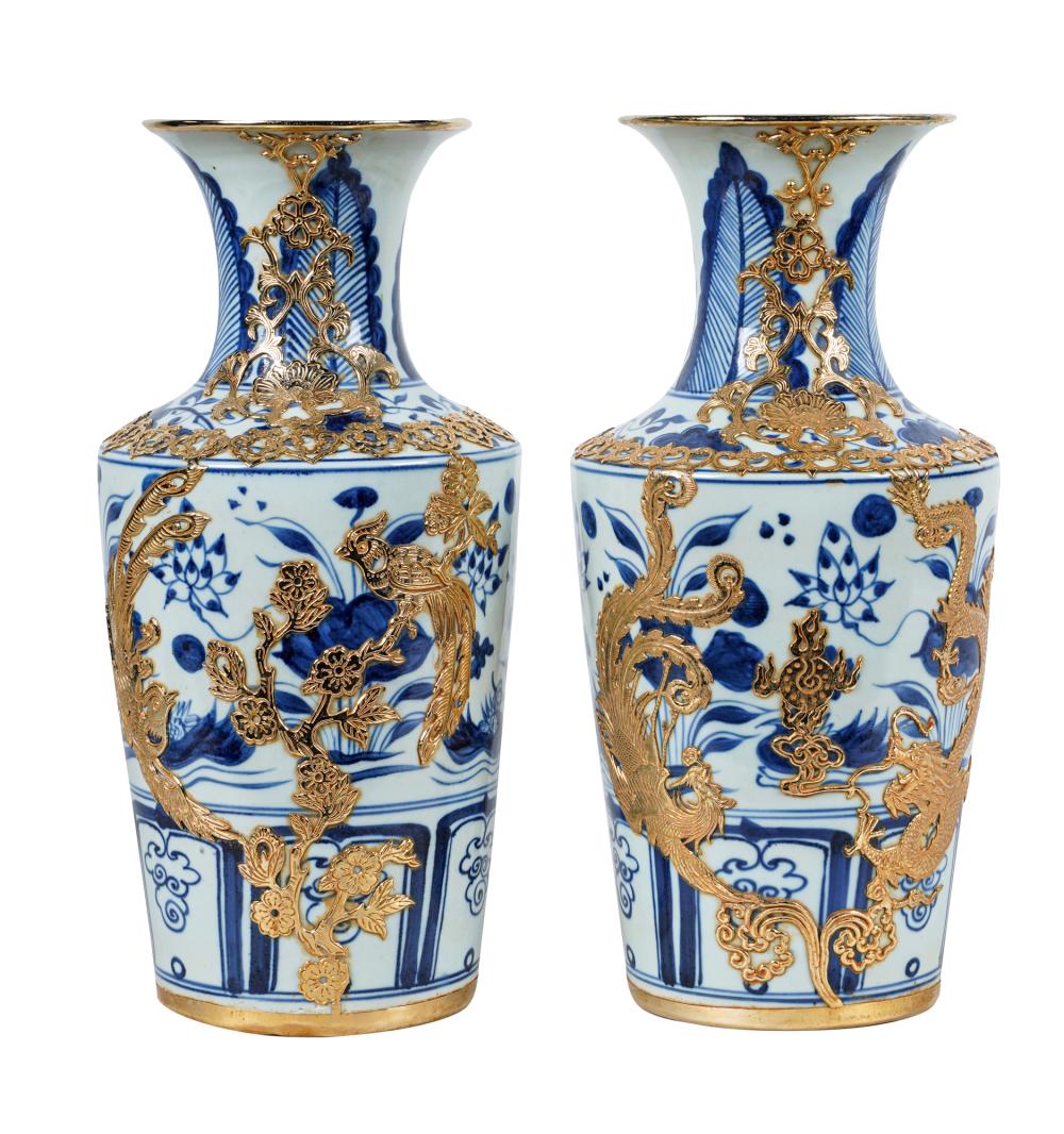 Appraisal: PAIR OF CHINESE BLUE WHITE PORCELAIN VASESwith bronze mounts each