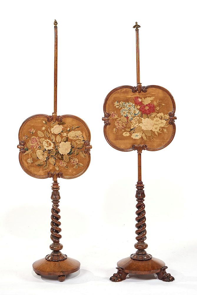 Appraisal: Pair of English style floral embroidered mahogany fire screens on