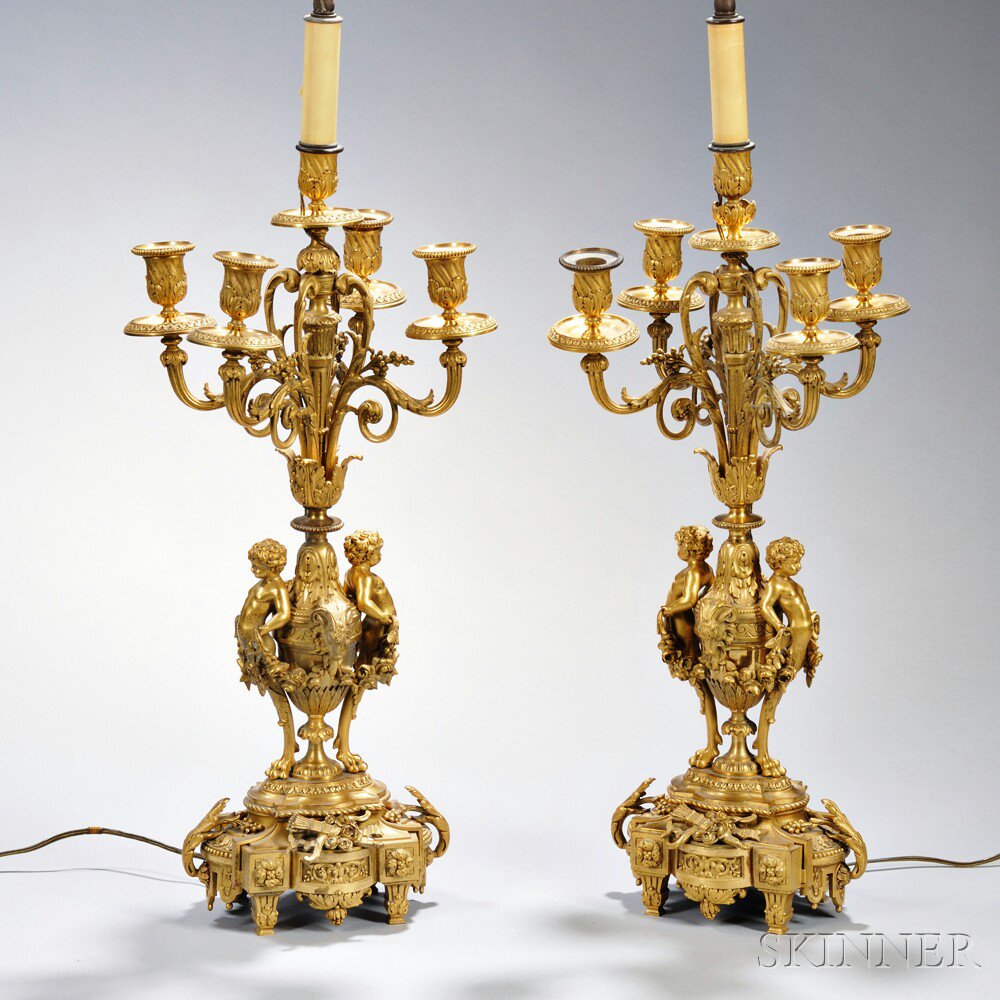 Appraisal: Pair of Gilt-bronze Figural Five-light Candelabra France th century each