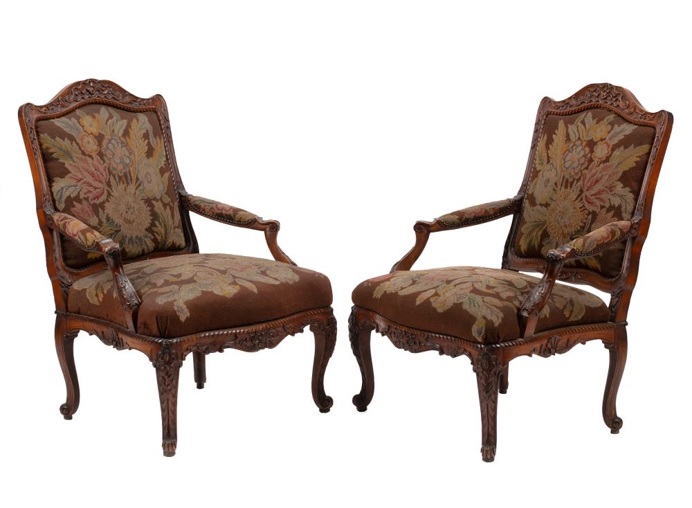 Appraisal: Pair of French Provincial Carved Walnut Fauteuils serpentine foliate crest