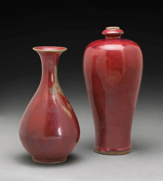 Appraisal: Two red flamb glazed stoneware vases th Century The first