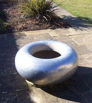 Appraisal: Torus by Mark de la Torre a circular aluminium garden