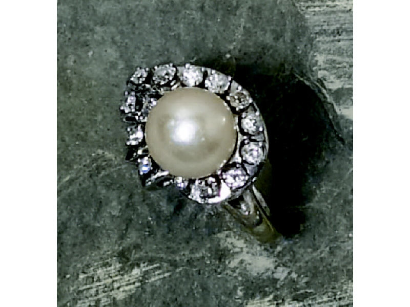 Appraisal: PEARL AND DIAMOND RING Lady's white gold ring set with