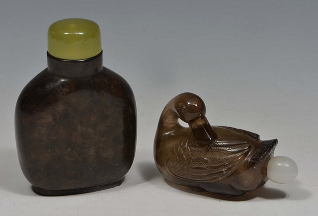 Appraisal: A CHINESE BLACK TINTED ROCK CRYSTAL SNUFF BOTTLE carved as