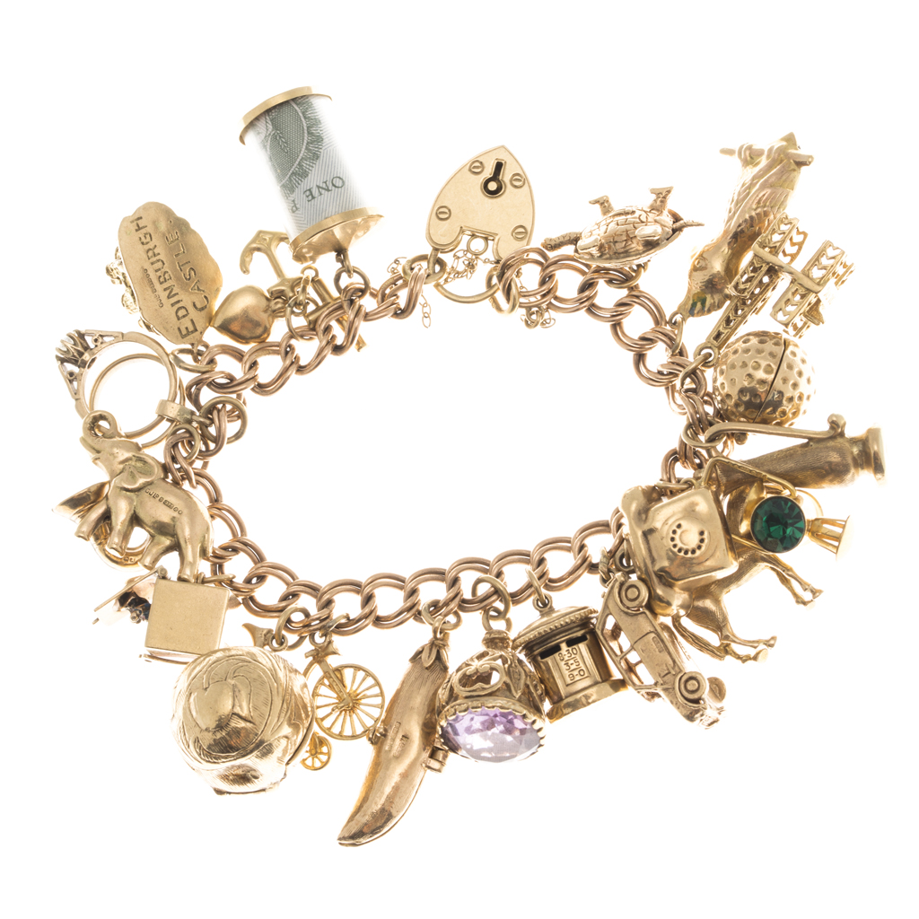 Appraisal: A ct gold charm bracelet composed of double curb links