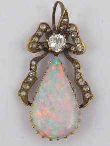 Appraisal: A teardrop shaped opal pendant set with diamonds the opal