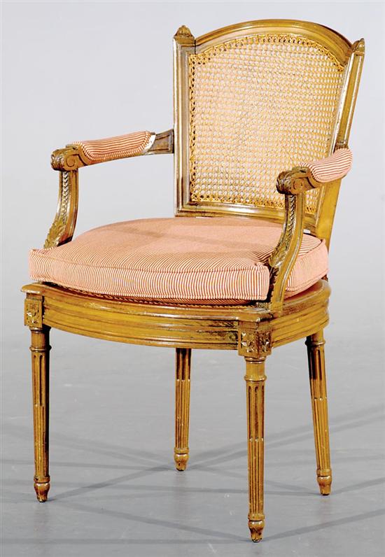 Appraisal: Louis XVI style carved fruitwood and cane armchair late th