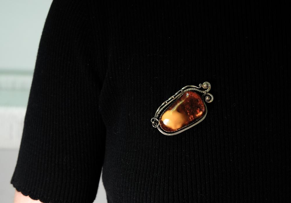 Appraisal: Large mm cabochon amber set in a vintage silver brooch