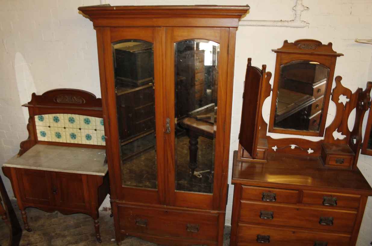 Appraisal: A thC satin walnut three piece bedroom suite comprising butterfly