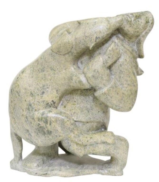 Appraisal: Inuit carved hardstone sculpture Man and Wolf attributed to Qavaroak