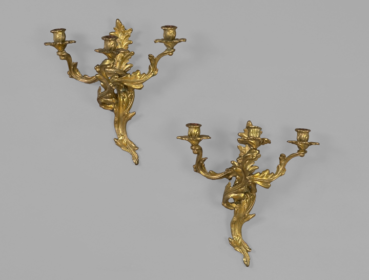 Appraisal: Pair of French Cast-Brass Three-Light Appliques in the Regence style