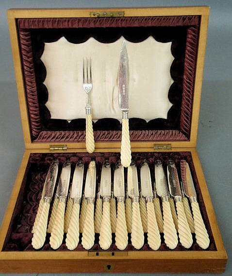 Appraisal: Cased silverplate bone handled flatware c twelve knives and forks