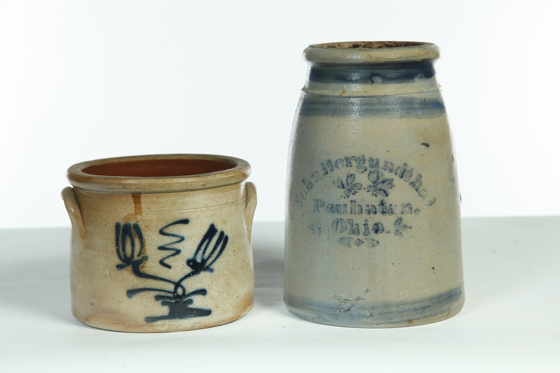 Appraisal: TWO STONEWARE JARS American th quarter- th century Stencil and