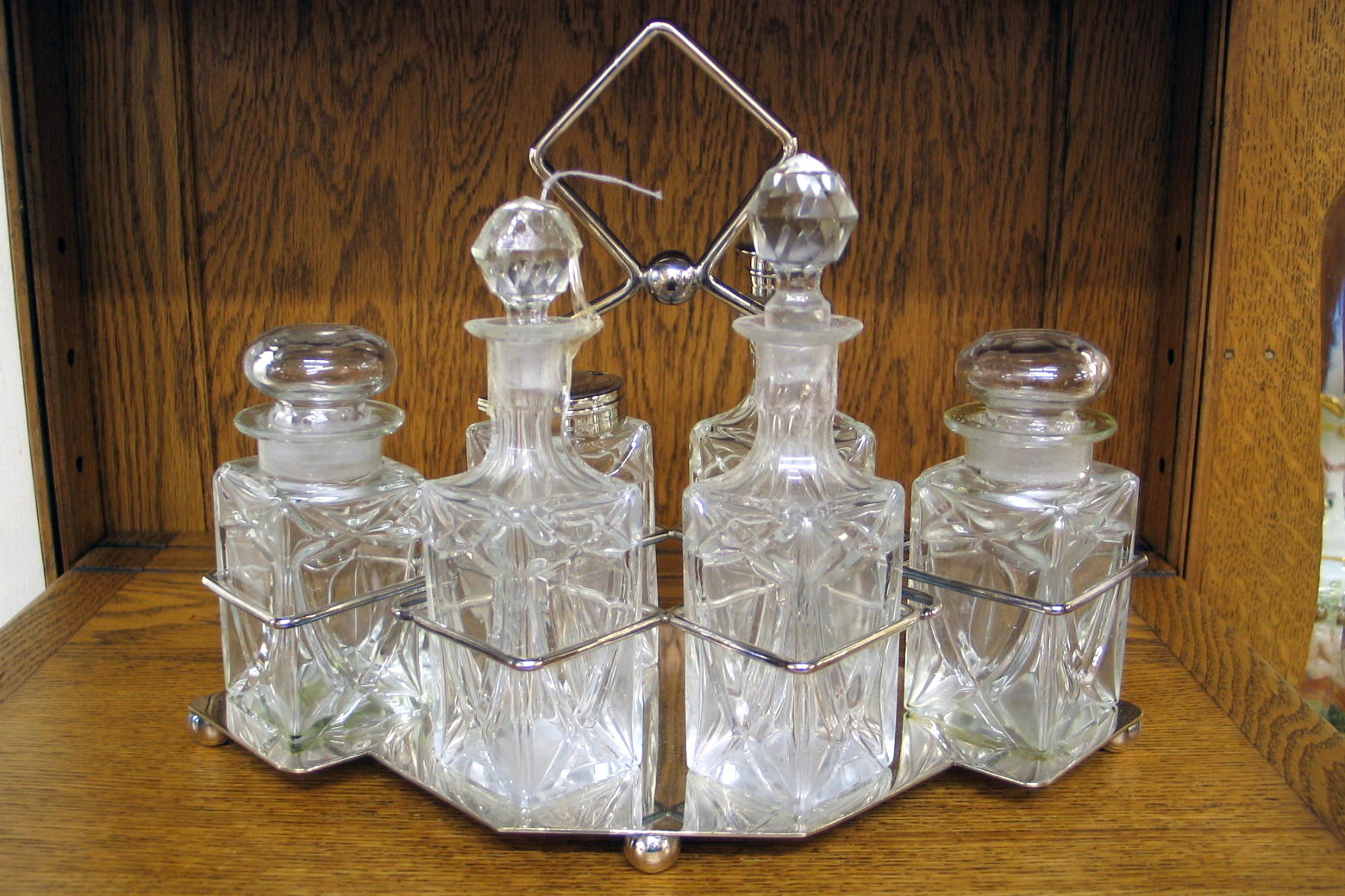 Appraisal: AN ENGLISH SILVERPLATED SIX-BOTTLE CASTOR SET having matching cut crystal