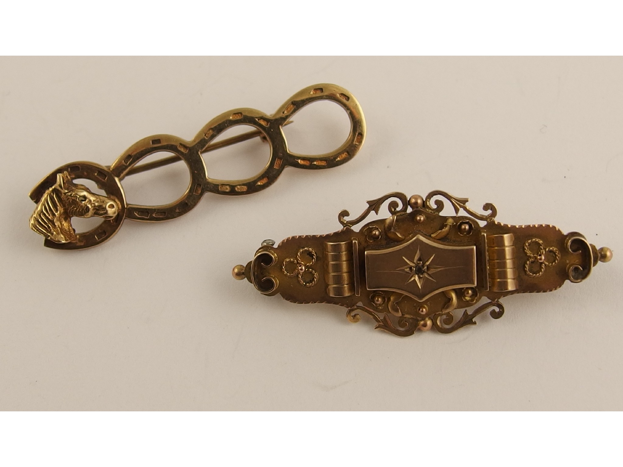 Appraisal: A ct horse and horseshoe brooch and a another ct