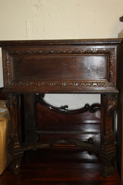 Appraisal: AN ITALIANATE CARVED COCKTAIL CABINET the front supports with mask