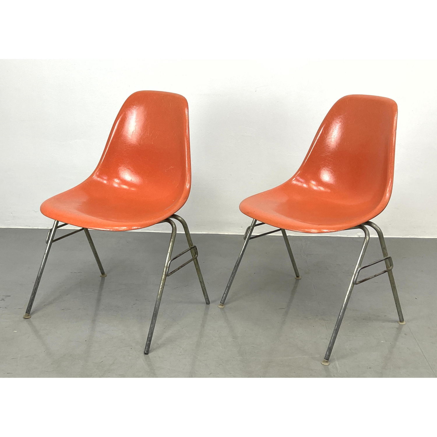 Appraisal: Pr Orange Eames shell chairs Herman Miller labels Fiberglass Dimensions