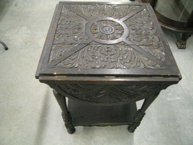 Appraisal: Carved Oak Victorian Handkerchief Table drop sides lower shelf