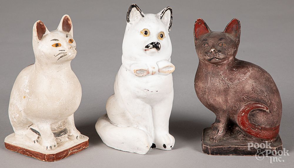 Appraisal: Three Pennsylvania chalkware cats Three Pennsylvania chalkware cats th c