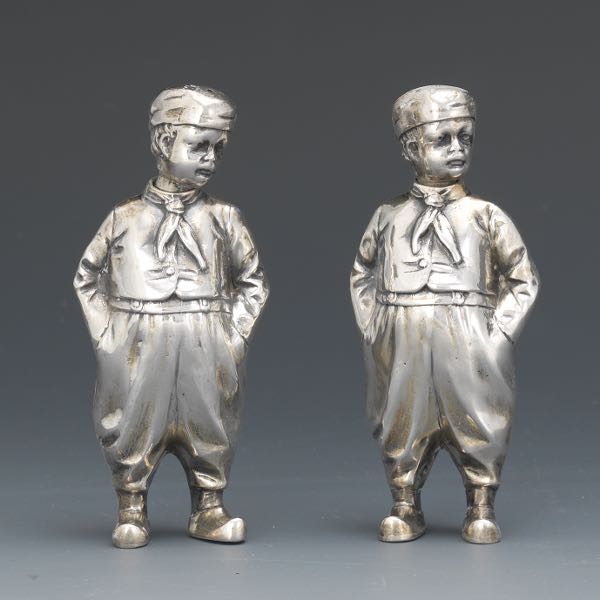 Appraisal: GERMAN STERLING SILVER PAIR OF TURKISH BOY SALT PEPPER SHAKERS