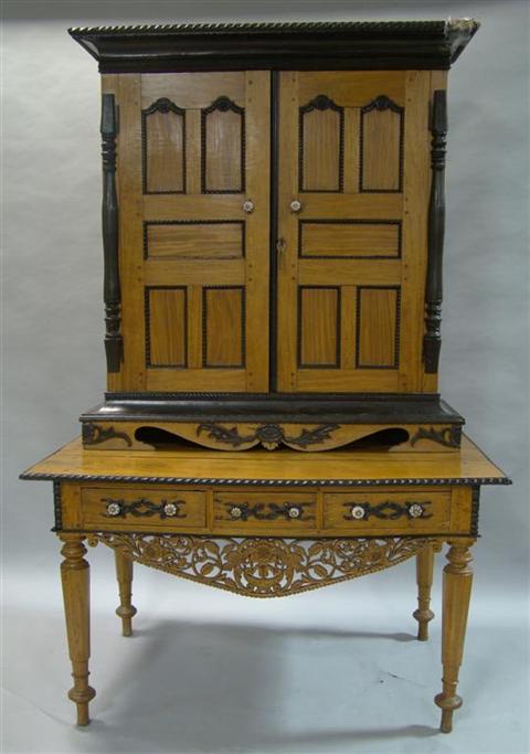 Appraisal: SRI LANKAN SATINWOOD AND EBONY CABINET ON DESK the molded