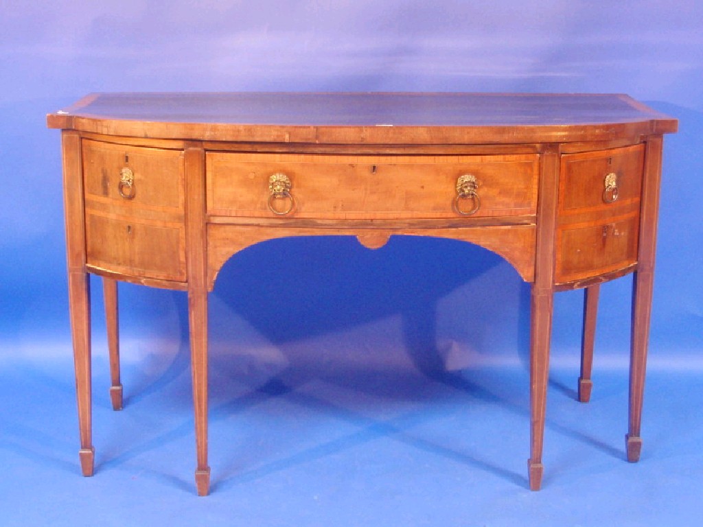 Appraisal: A thC mahogany bow front sideboard with a satinwood cross