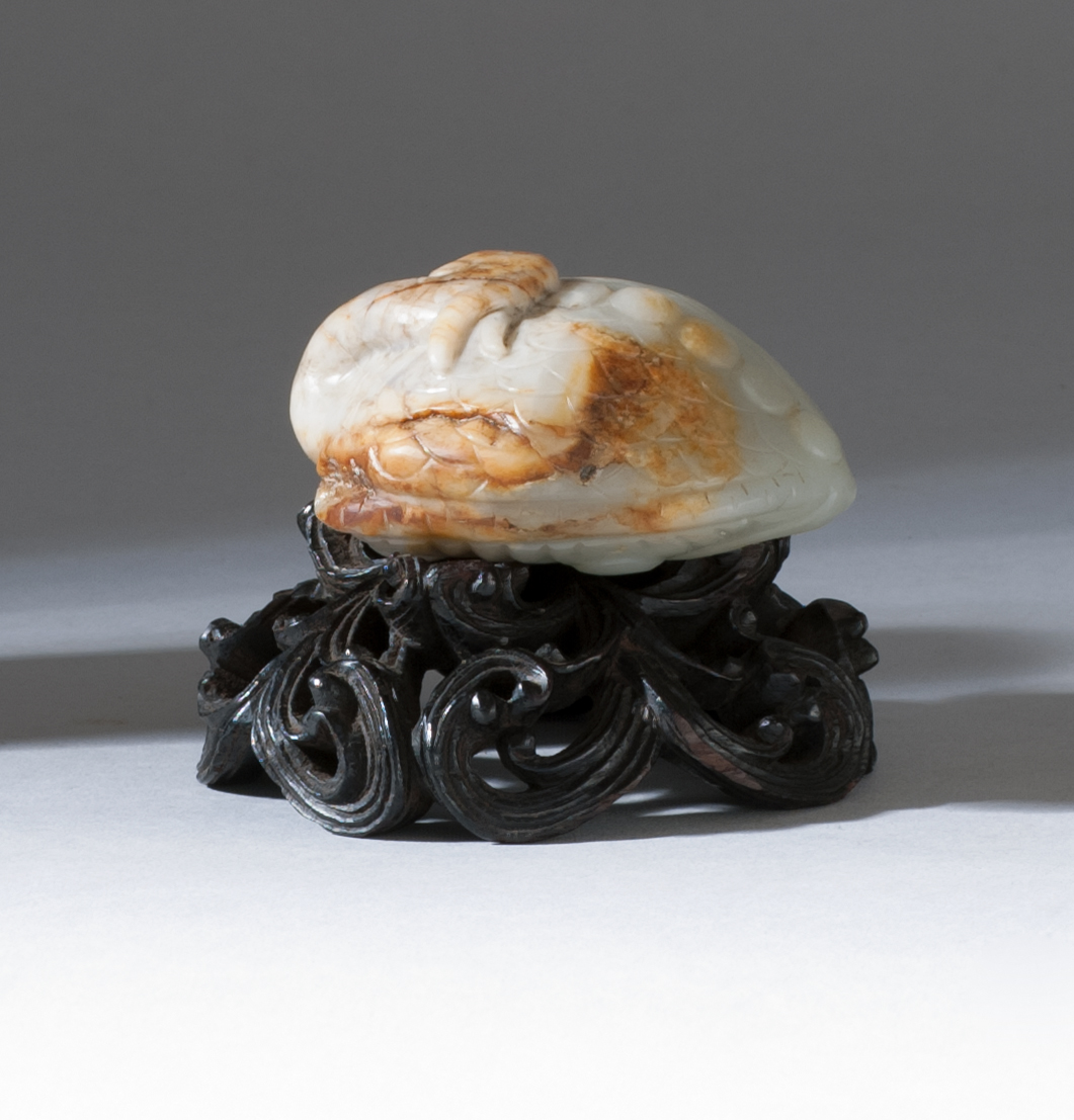 Appraisal: GRAY AND RUSSET JADE CARVING th CenturyIn the form of