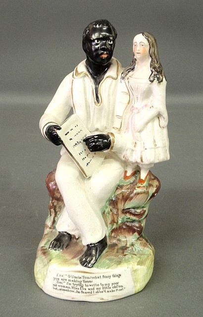 Appraisal: - Staffordshire seated Uncle Tom and Eva c the base