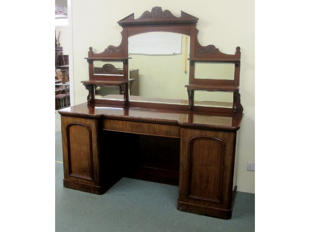 Appraisal: A Victorian mahogany mirrorback pedestal sideboard the overmantel mirror flanked