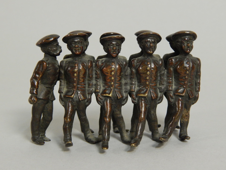 Appraisal: An early thC bronze group in the form of nine