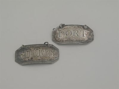 Appraisal: A pair of George III canted oblong wine labels with