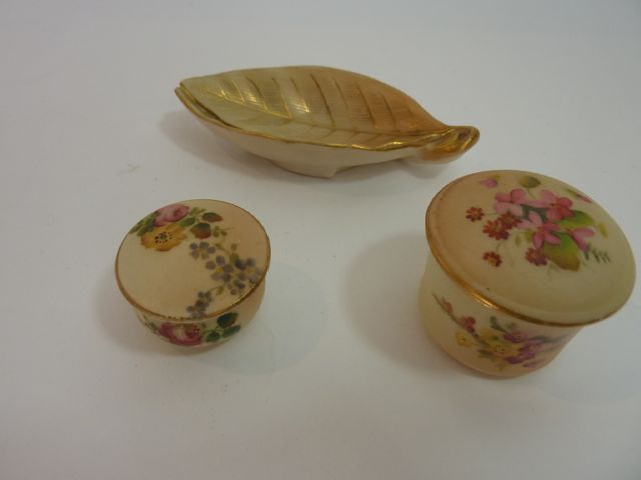 Appraisal: Two miniature Royal Worcester Blush Ivory trinket boxes and covers