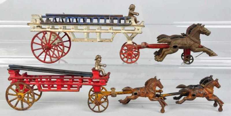 Appraisal: Lot of Cast Iron Horse-Drawn Ladder Truck Toys American Includes