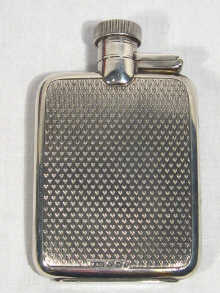 Appraisal: A small silver hip spirit flask with engine turned decoration