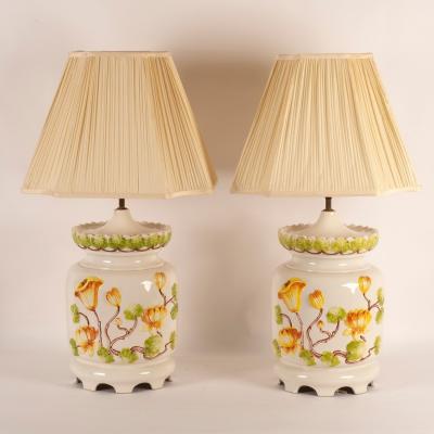 Appraisal: A pair of large pottery table lamps decorated lilies in