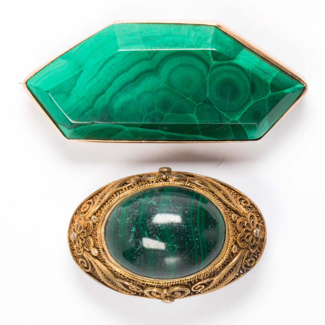 Appraisal: A GROUP OF MALACHITE BROOCHES A group of malachite brooches