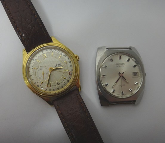 Appraisal: A gentleman's gilt metal fronted and steel back Oris Automatic