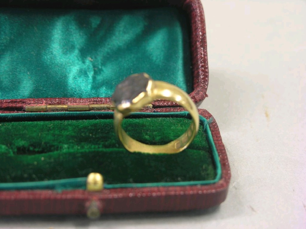 Appraisal: An ct gold ring set with intaglio relief portrait bust