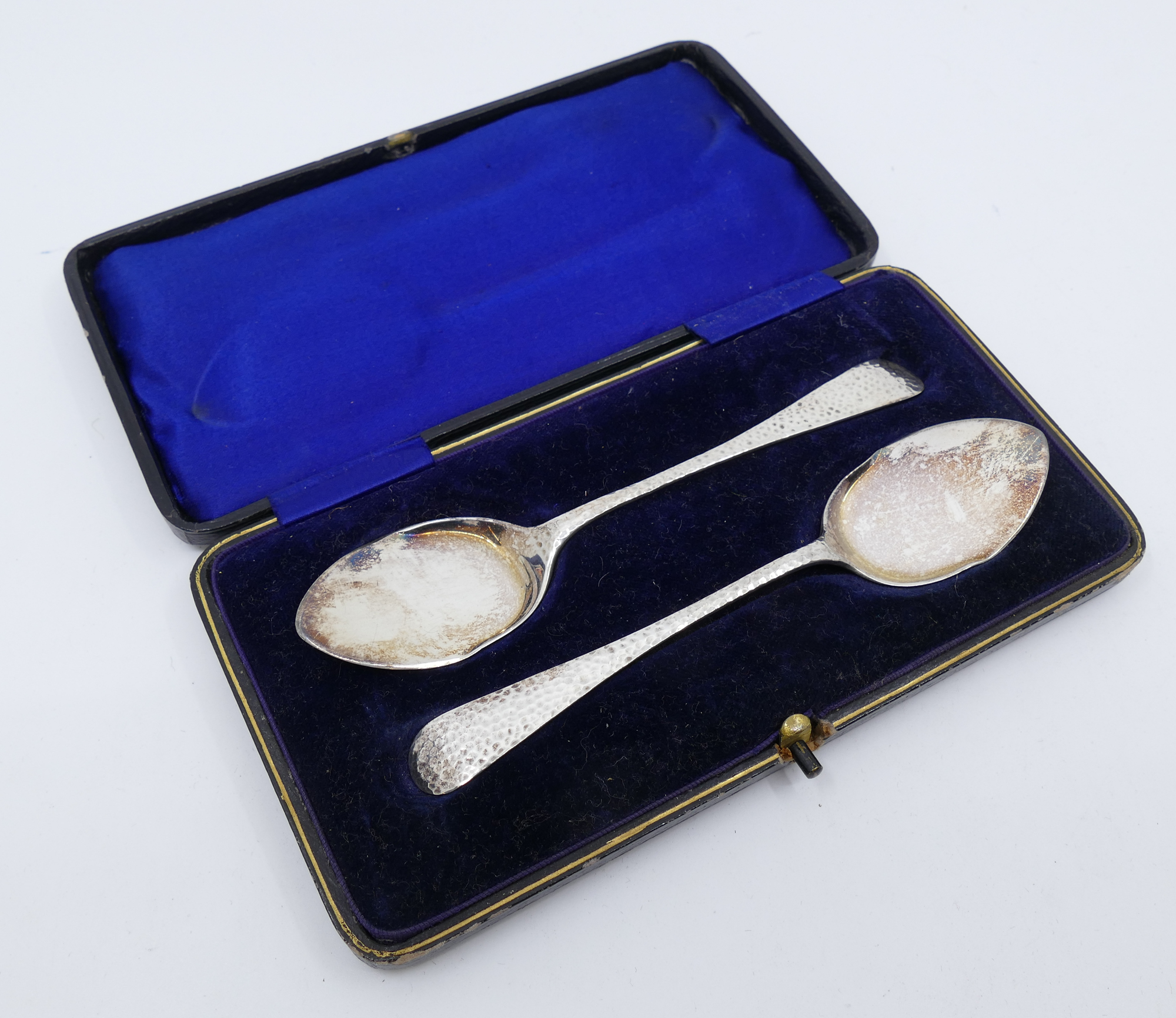 Appraisal: Pair English Sterling Hand Hammered Flat Serving Spoons- '' each