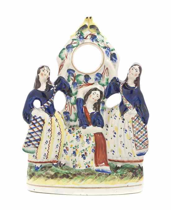 Appraisal: A Staffordshire Figural Pocketwatch Stand depicting three maidens in ethnic