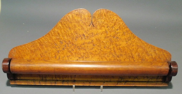 Appraisal: Bird s-eye maple towel rack with a broken arch back