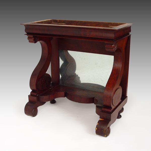 Appraisal: EMPIRE PERIOD MAHOGANY PIER TABLE Mirrored back between two scrolled