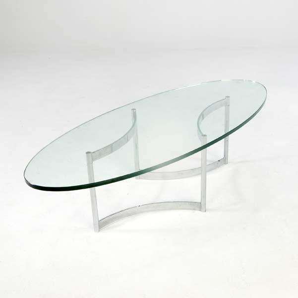 Appraisal: JOHN STUART Coffee table with elliptical glass top on polished