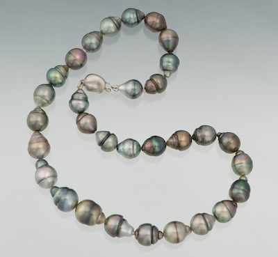 Appraisal: A Tahitian Baroque Pearl Necklace Thirty-one grey color baroque pearl