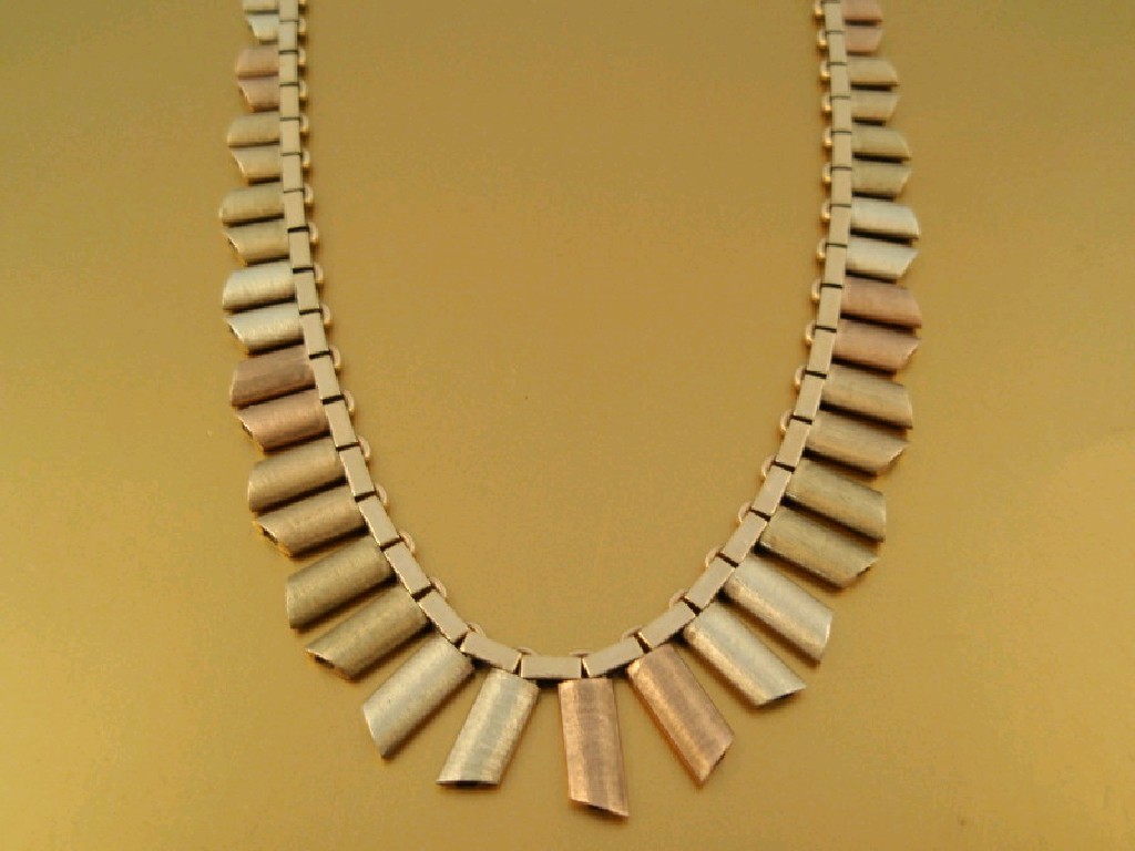 Appraisal: A graduated tri-colour ct gold brickette necklace g