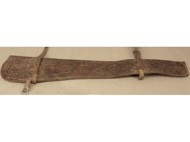 Appraisal: Floral tooled leather rifle scabbard with straps unmarked with good