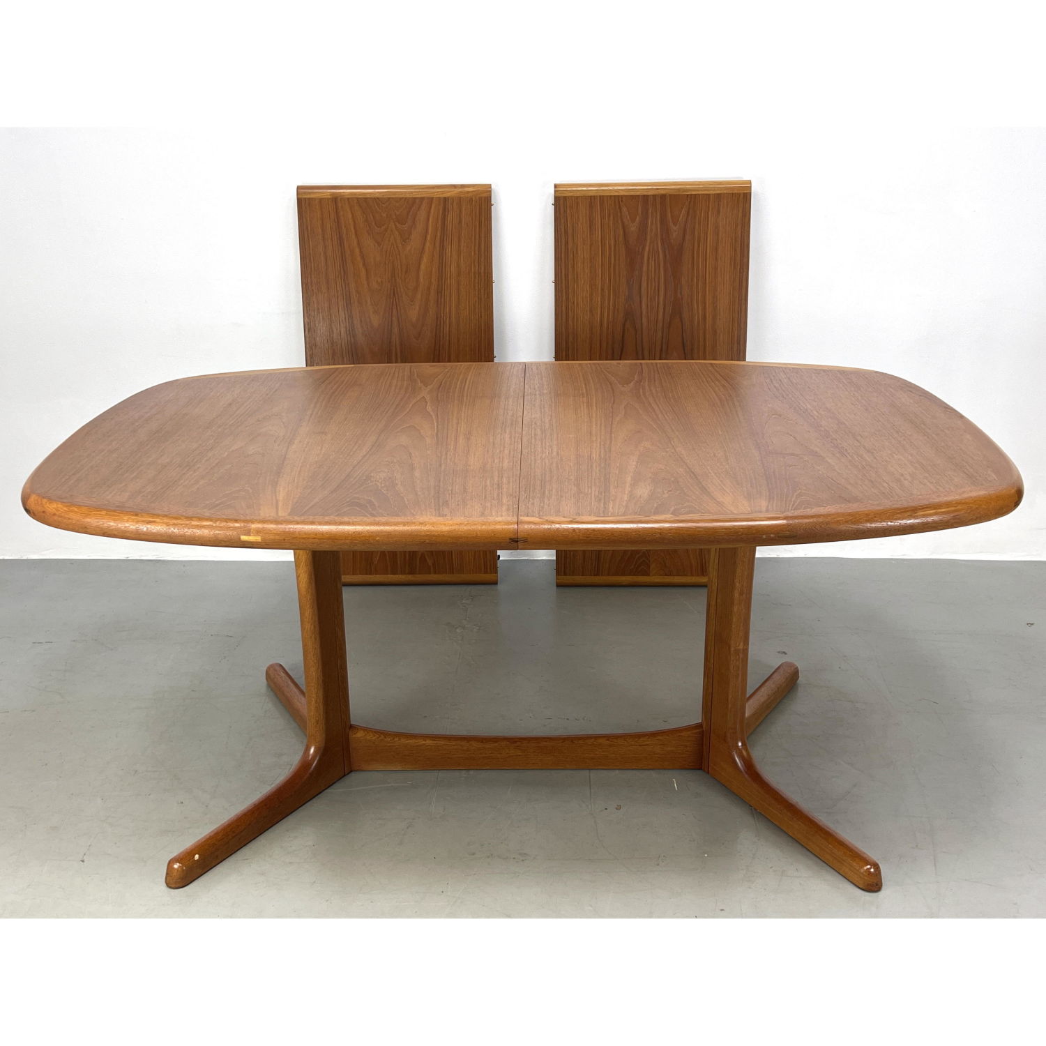 Appraisal: Dyrlund teak dining table with trestle base Includes - inch